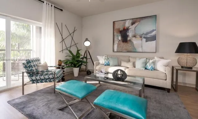 a living room with furniture and a large window