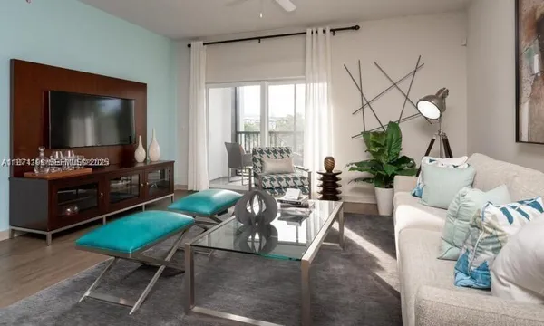 a living room with furniture and a flat screen tv
