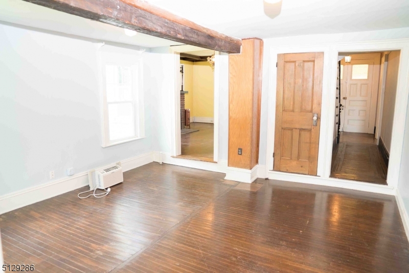168 East Main Street Lebanon, NJ 08833 - Photo 13 of 33 a view of an empty room with wooden floor and a window