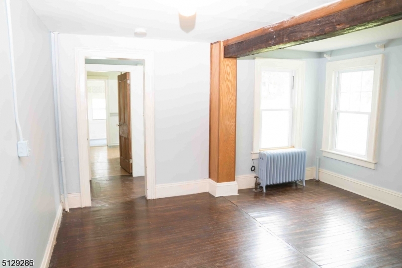 168 East Main Street Lebanon, NJ 08833 - Photo 14 of 33 a view of an empty room with wooden floor and a window