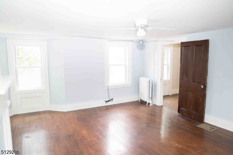 168 East Main Street Lebanon, NJ 08833 - Photo 16 of 33 a view of an empty room with wooden floor and a window
