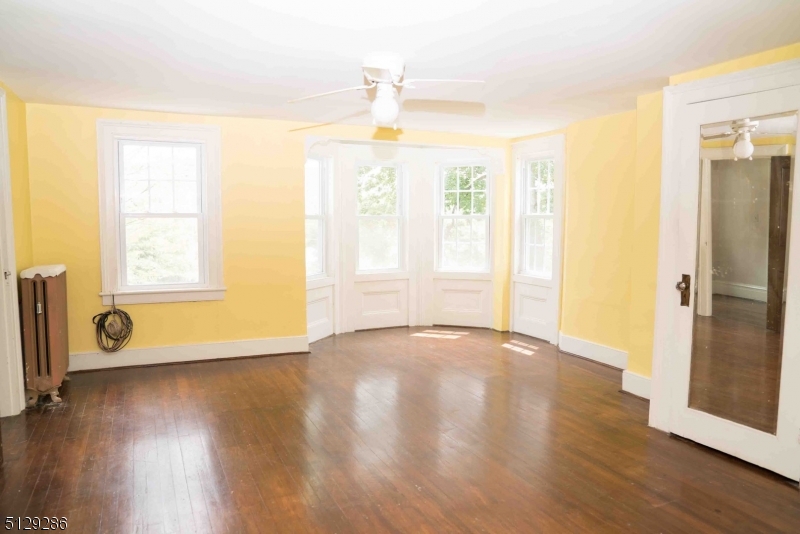 168 East Main Street Lebanon, NJ 08833 - Photo 19 of 33 a view of an empty room with wooden floor and a window