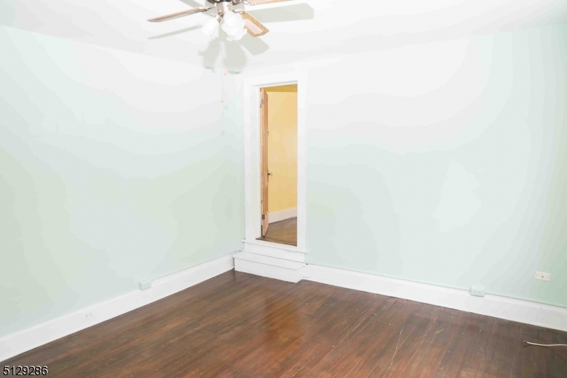 168 East Main Street Lebanon, NJ 08833 - Photo 21 of 33 an empty room with wooden floor and fan