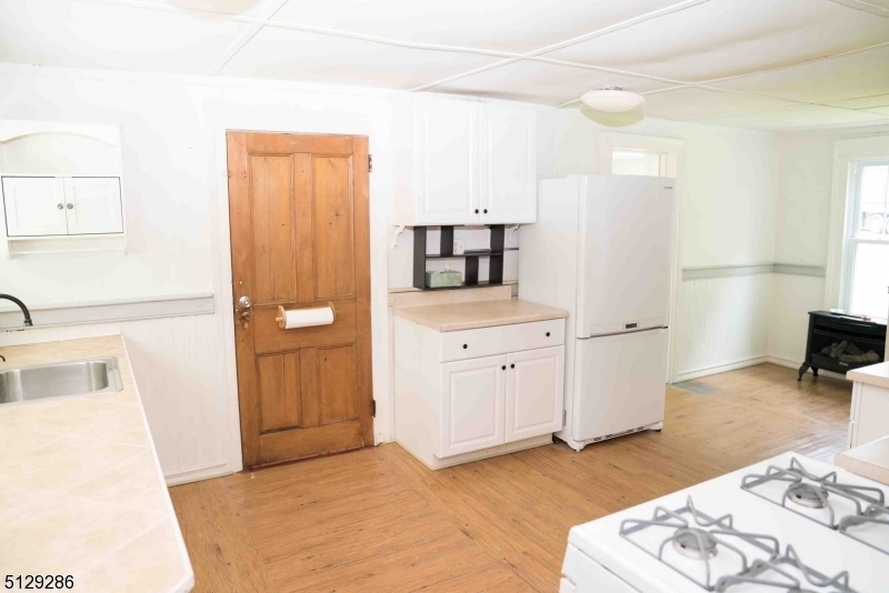 168 East Main Street Lebanon, NJ 08833 - Photo 27 of 33 a kitchen with white cabinets and sink