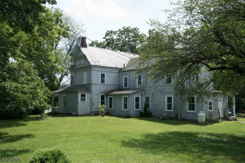 168 East Main Street Lebanon, NJ 08833 - Photo 32 of 33 a front view of a house with a garden