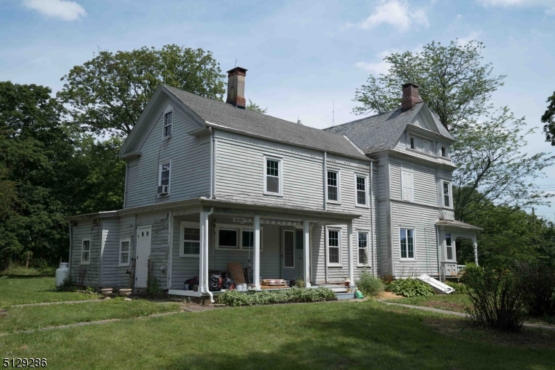 168 East Main Street Lebanon, NJ 08833 - Photo 33 of 33 a front view of a house with a yard and trees