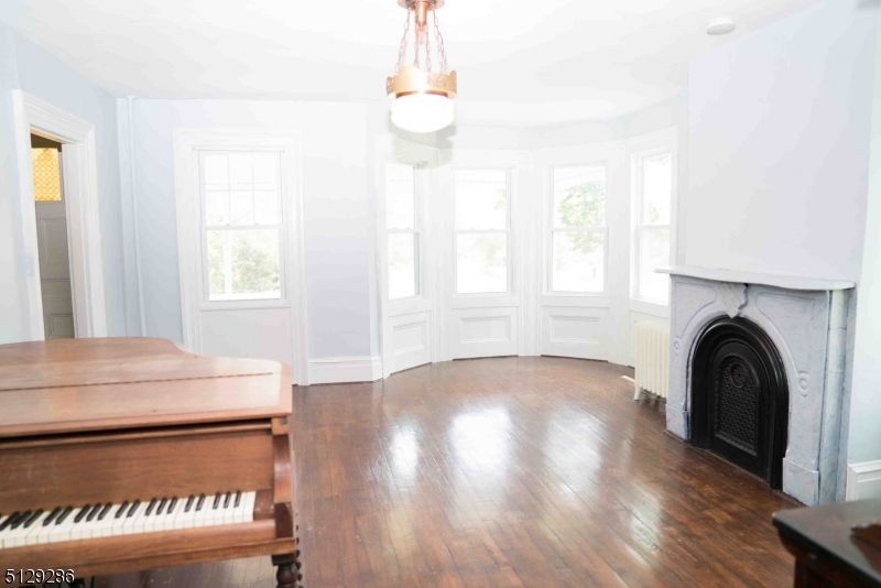 168 East Main Street Lebanon, NJ 08833 - Photo 4 of 33 a view of a kitchen with a stove wooden floor and a window