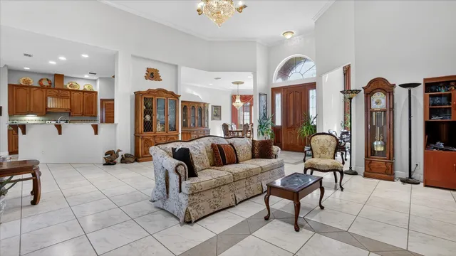 a living room with furniture a rug and a piano