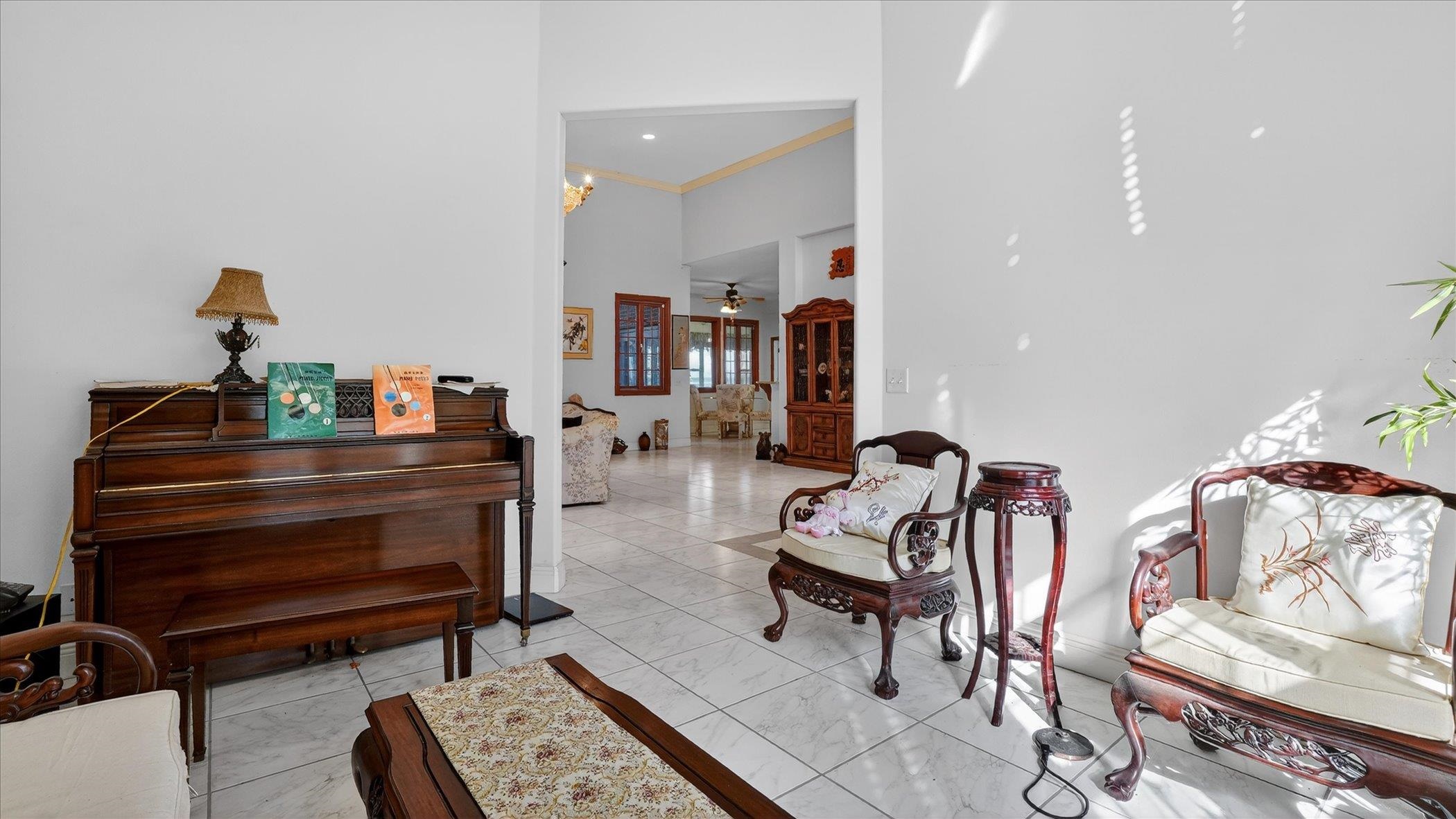 453 Federal Point Road East Palatka, FL 32131 - Photo 16 of 68 a living room with furniture a rug and a piano