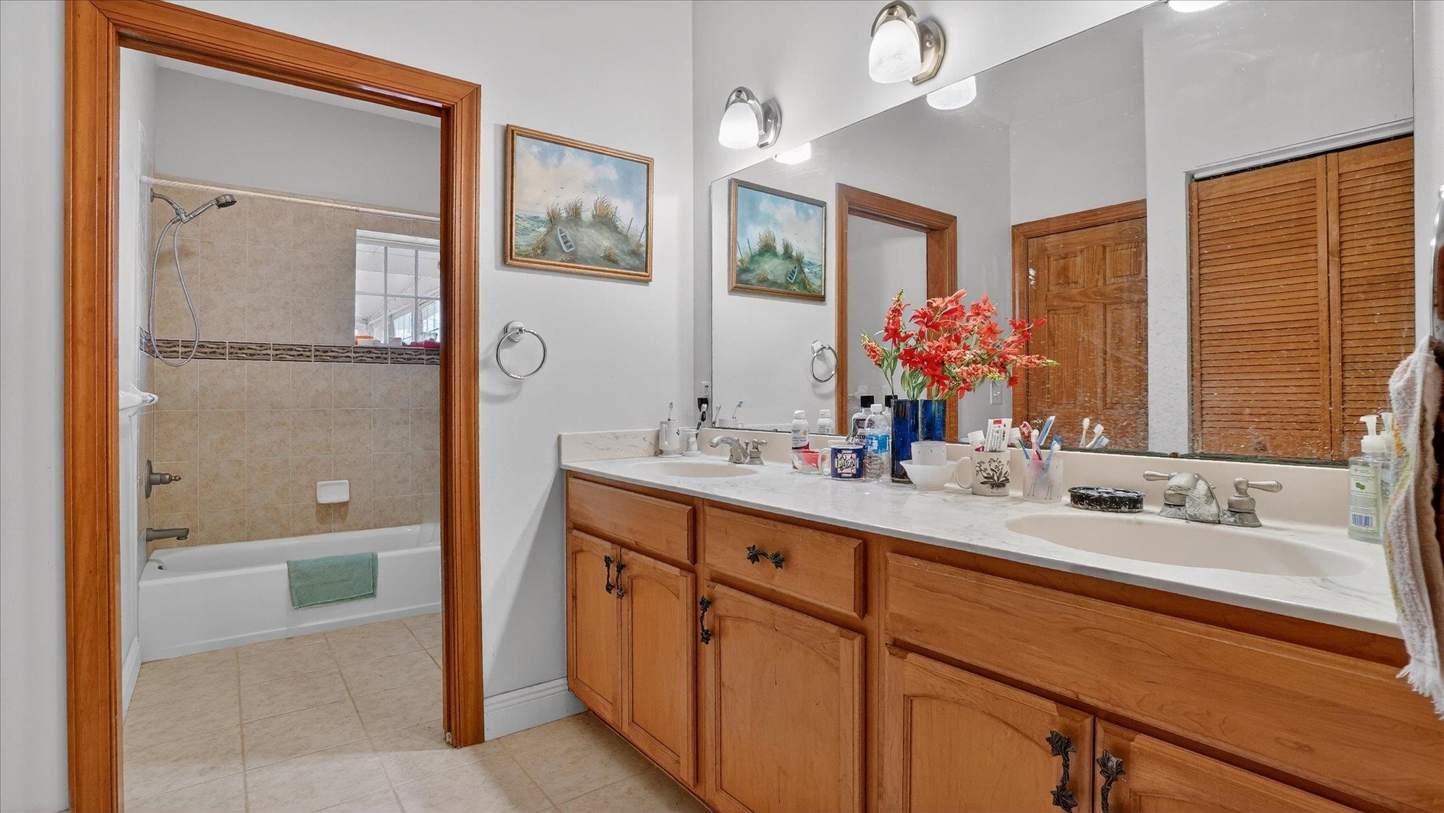 453 Federal Point Road East Palatka, FL 32131 - Photo 21 of 68 a bathroom with a bathtub shower sink and mirror