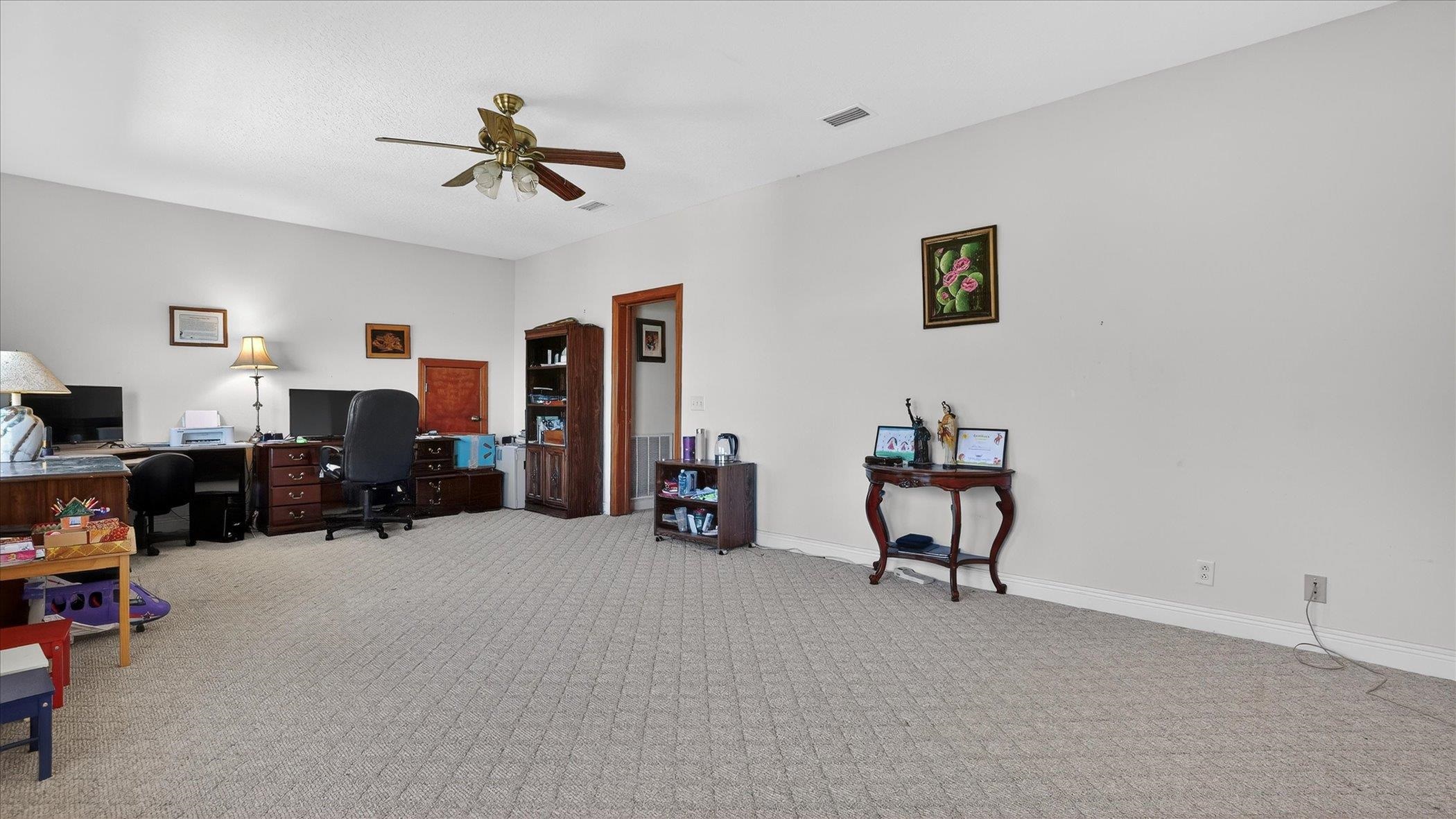453 Federal Point Road East Palatka, FL 32131 - Photo 23 of 68 a living room with furniture and a flat screen tv