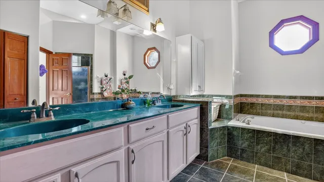 a bedroom with a bed and a large mirror