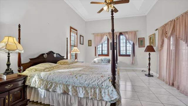 a spacious bathroom with a double vanity sink and a large mirror