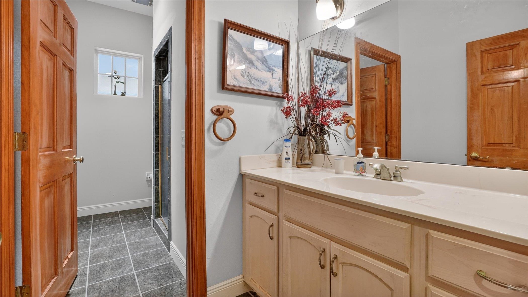 453 Federal Point Road East Palatka, FL 32131 - Photo 30 of 68 a en suite bathroom with a sink mirror and a shower