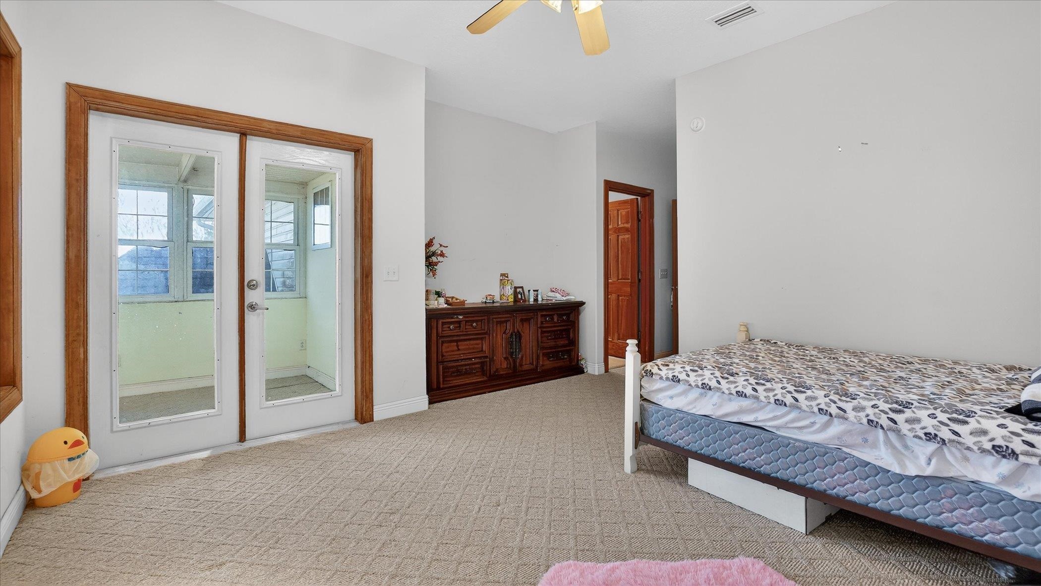 453 Federal Point Road East Palatka, FL 32131 - Photo 38 of 68 a bedroom with a bed and a cabinets