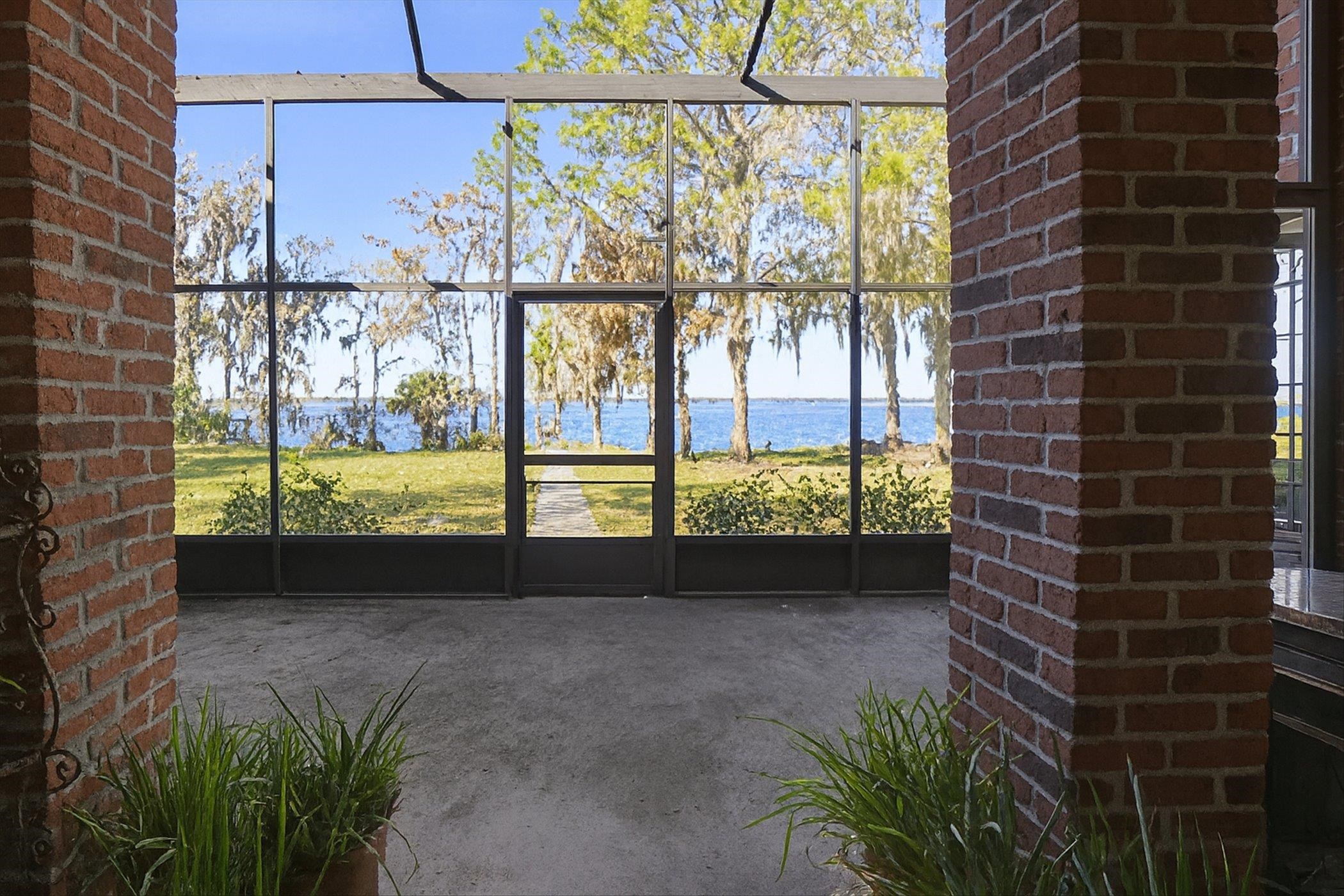 453 Federal Point Road East Palatka, FL 32131 - Photo 49 of 68 Unfurnished sunroom with a water view