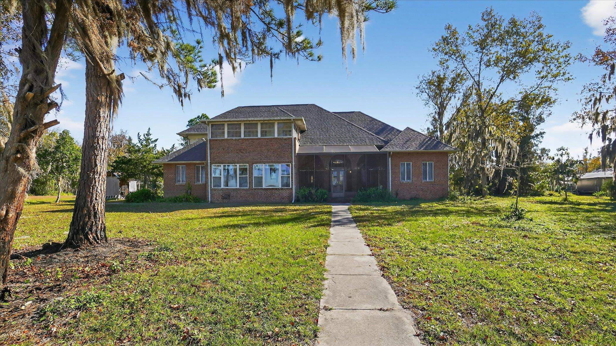 453 Federal Point Road East Palatka, FL 32131 - Photo 52 of 68 a front view of a house with a yard