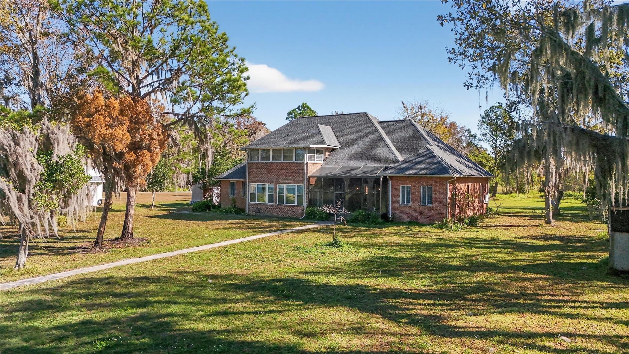 453 Federal Point Road East Palatka, FL 32131 - Photo 59 of 68 a front view of a house with a yard table and chairs