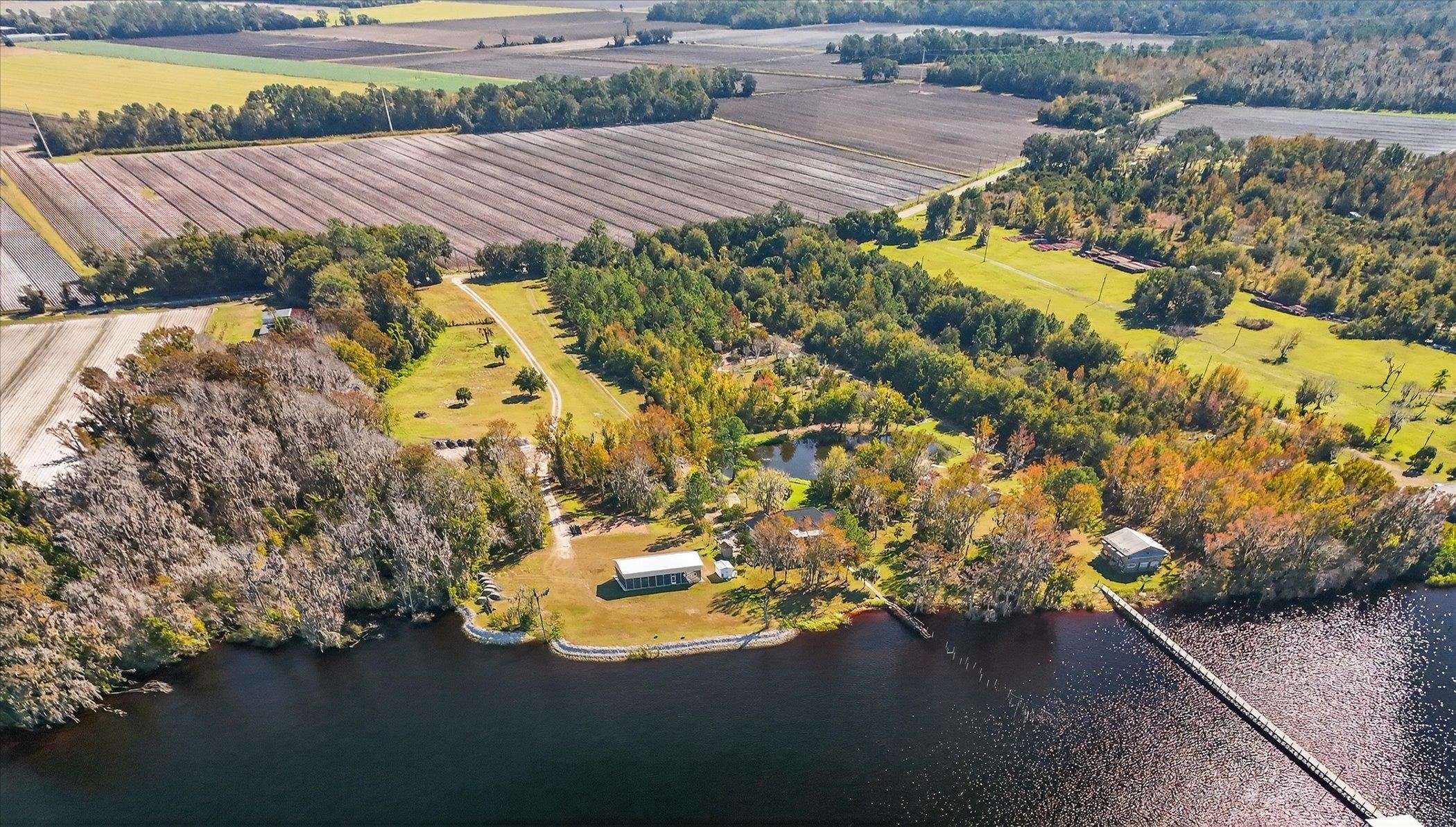453 Federal Point Road East Palatka, FL 32131 - Photo 63 of 68 a view of a swimming pool with an outdoor space and seating area