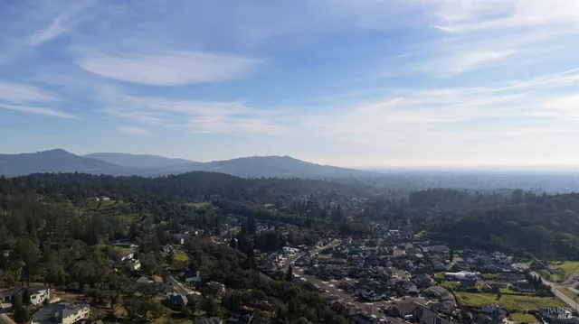 a view of a city with mountains in the background