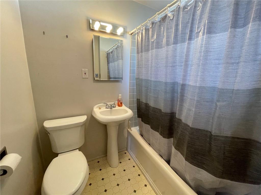 405 Routh Street Monroeville, PA 15146 - Photo 15 of 18 a bathroom with a sink toilet and shower