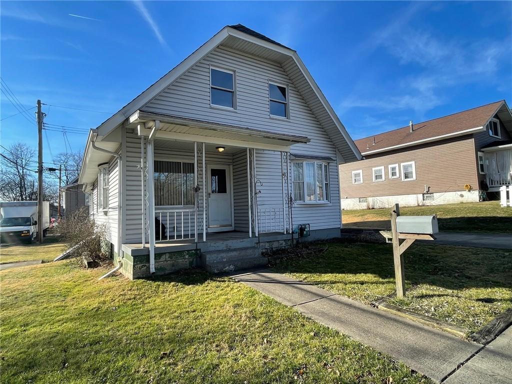 405 Routh Street Monroeville, PA 15146 - Photo 16 of 18 a front view of a house with garden