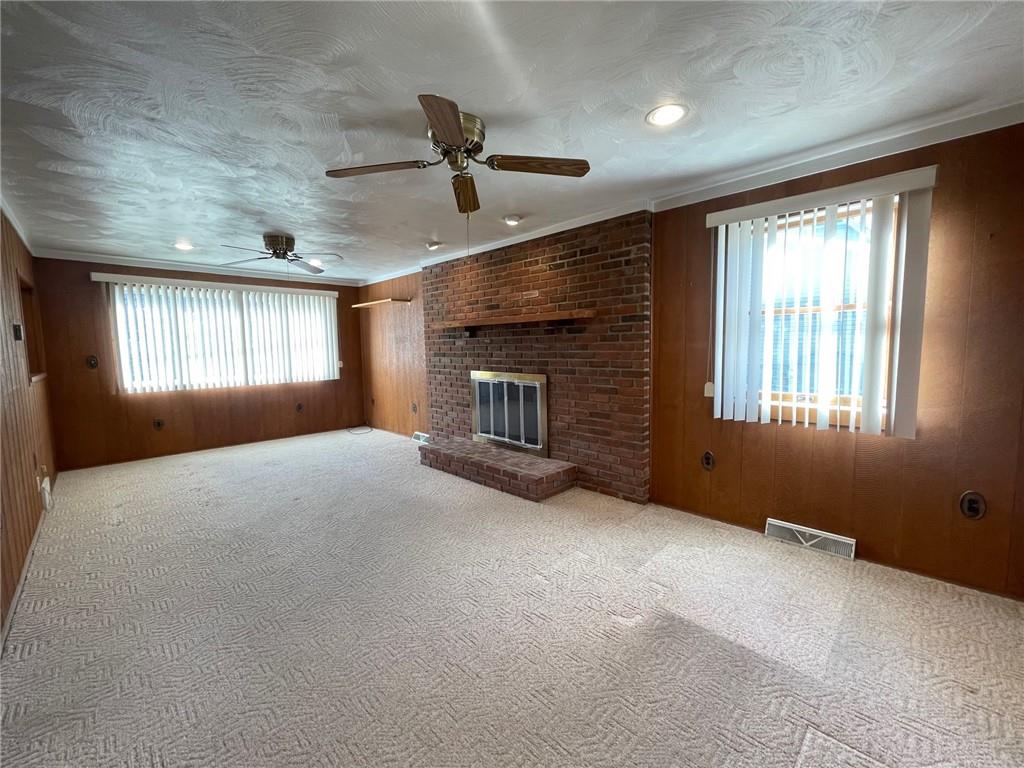 405 Routh Street Monroeville, PA 15146 - Photo 7 of 18 a view of empty room with windows and fireplace