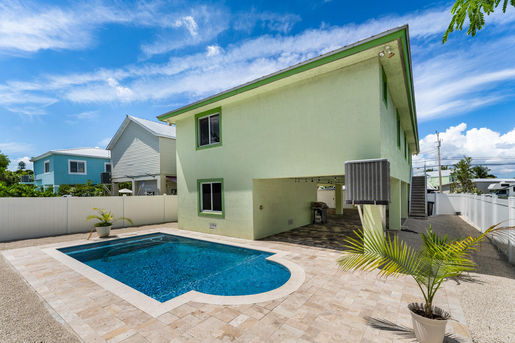 955 Plantation Road Key Largo, FL 33037 - Photo 27 of 37 a swimming pool with outdoor seating
