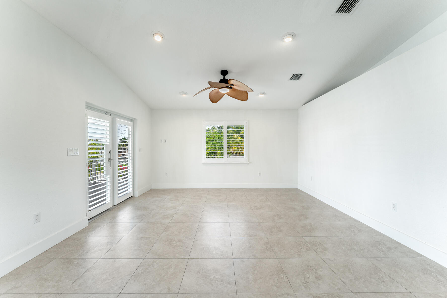 955 Plantation Road Key Largo, FL 33037 - Photo 3 of 37 an empty room with windows and natural light