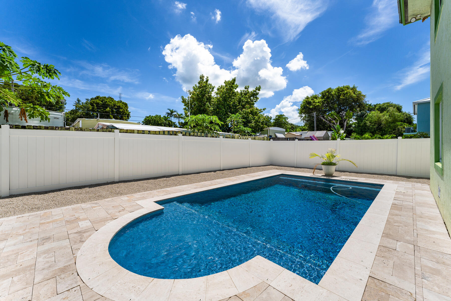 955 Plantation Road Key Largo, FL 33037 - Photo 31 of 37 a view of a swimming pool with an outdoor seating area
