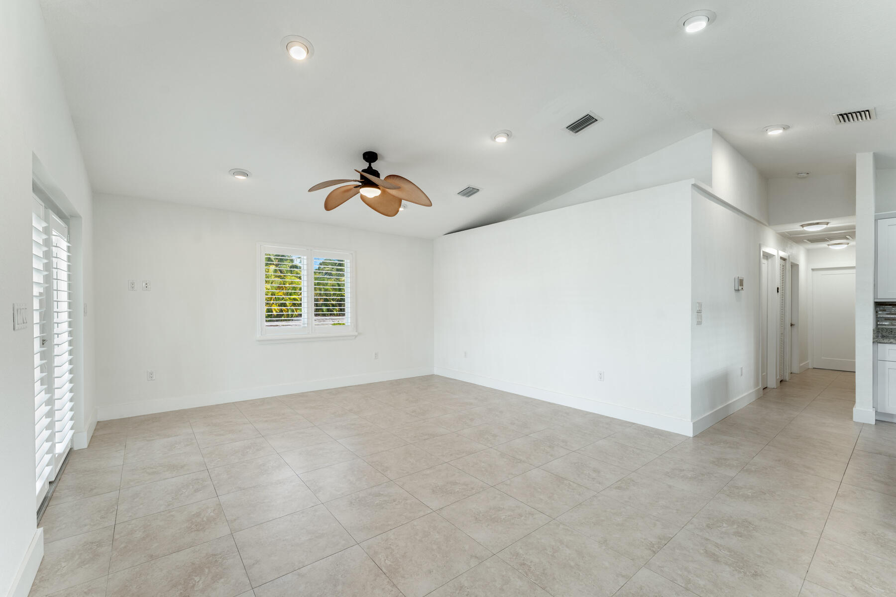 955 Plantation Road Key Largo, FL 33037 - Photo 5 of 37 wooden floor in an empty room with a window