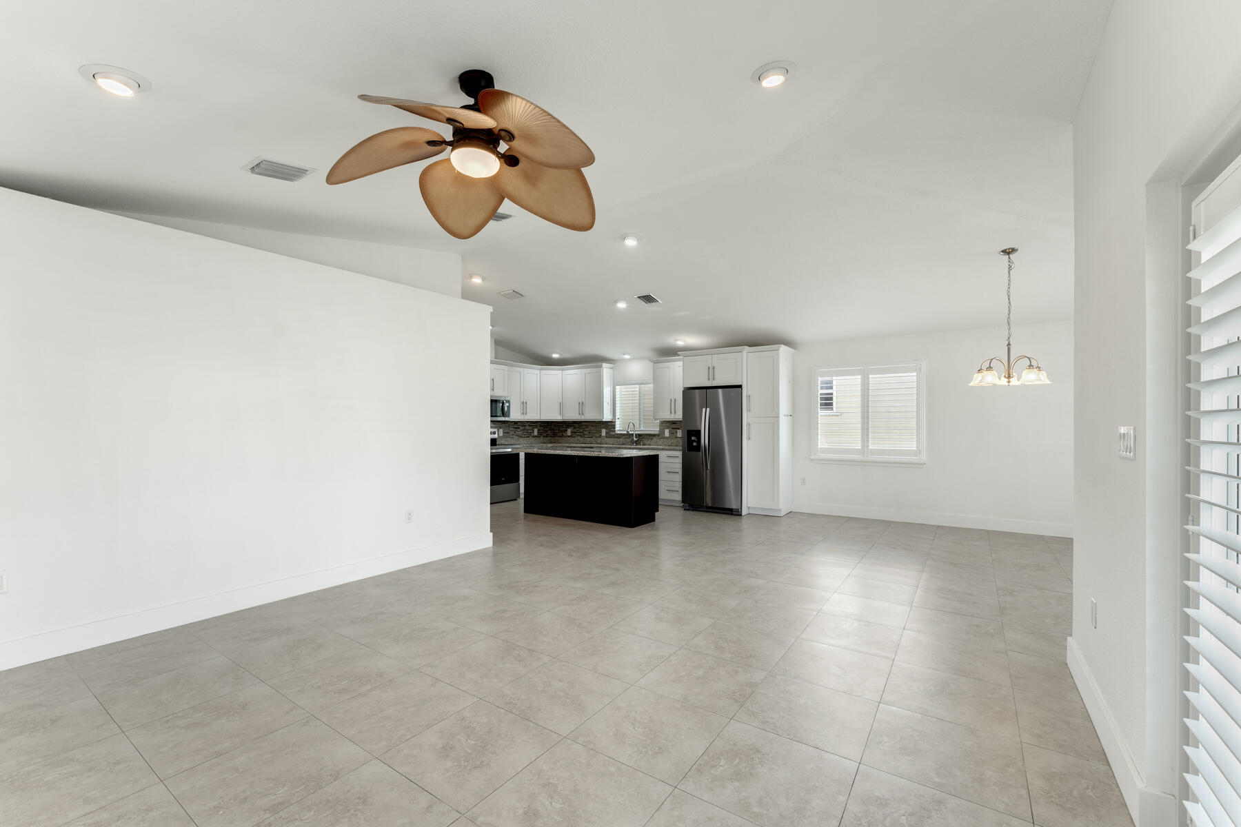 955 Plantation Road Key Largo, FL 33037 - Photo 6 of 37 a living room with kitchen island furniture and a window