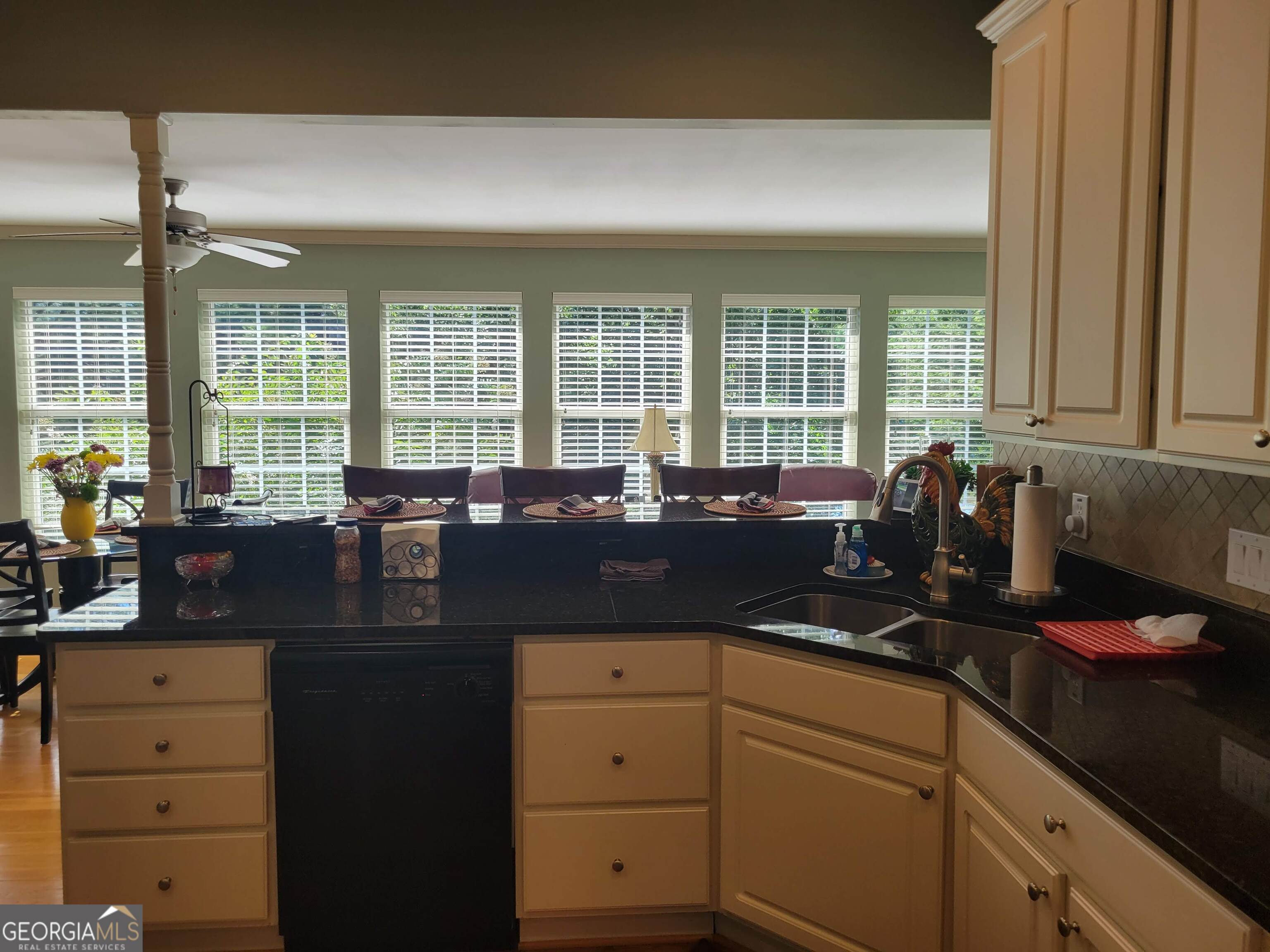5325 Bethlehem Road Fairburn, GA 30213 - Photo 11 of 21 a kitchen with a sink stove and cabinets