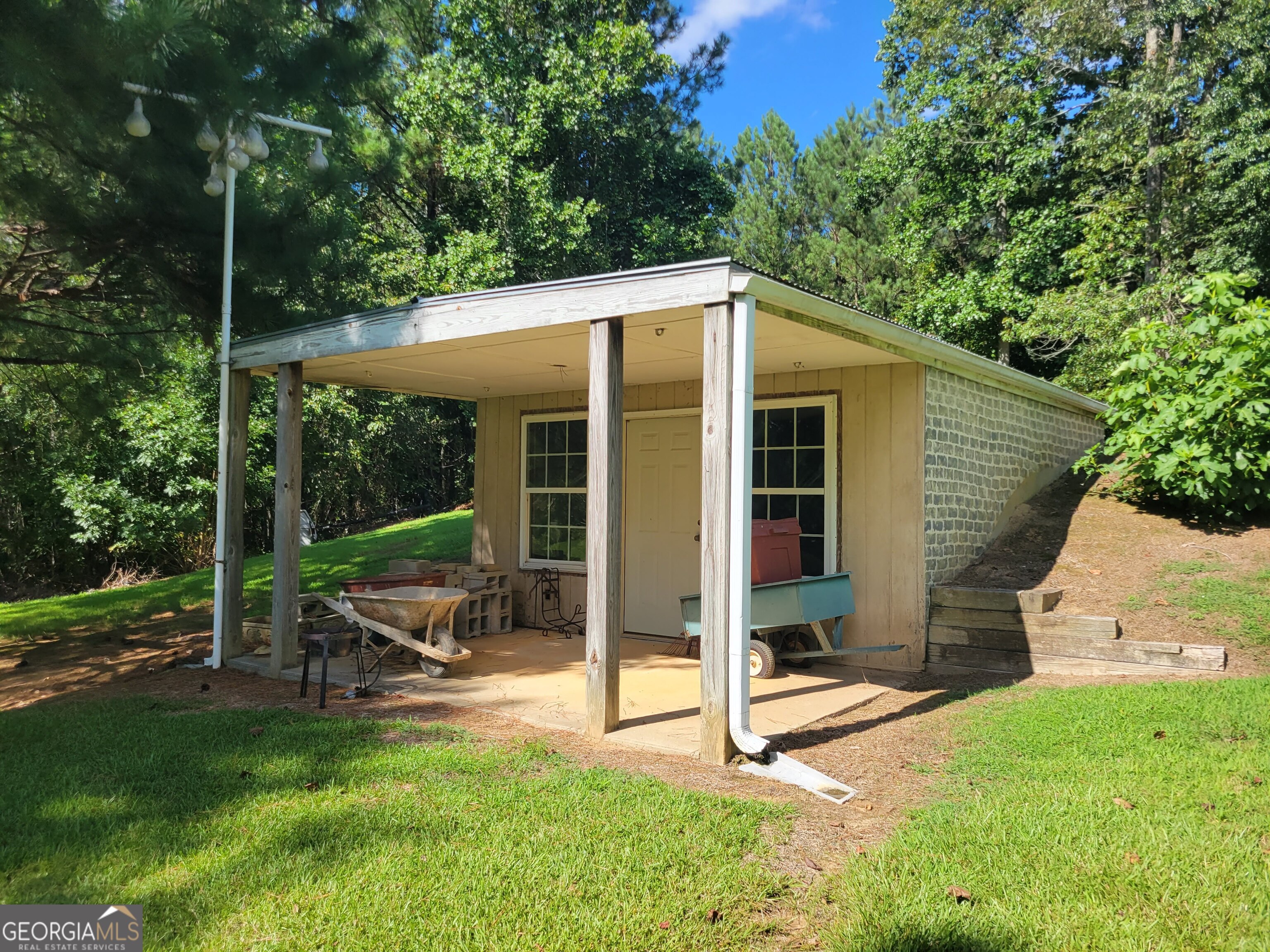 5325 Bethlehem Road Fairburn, GA 30213 - Photo 21 of 21 a view of a house with backyard porch and sitting area
