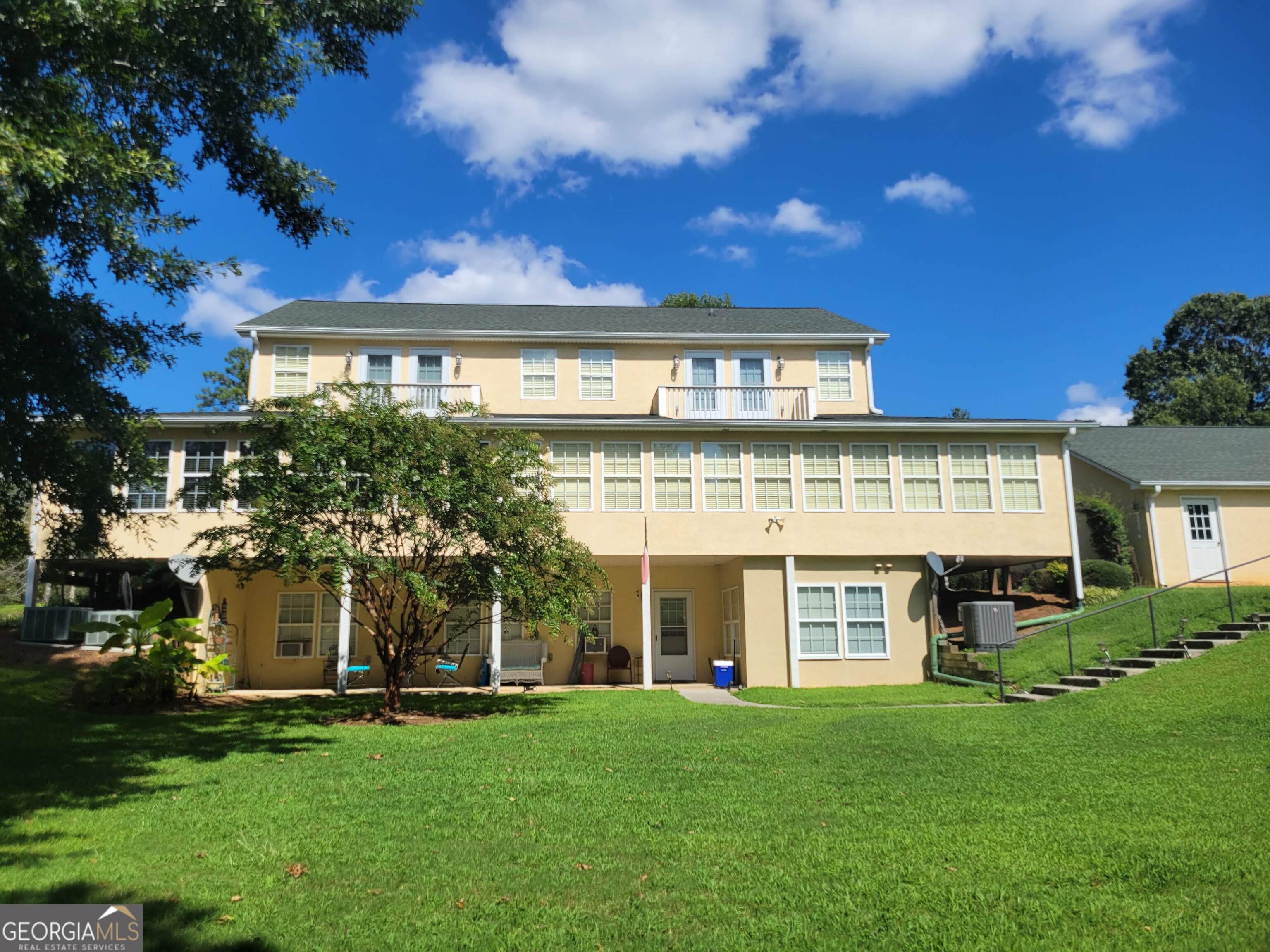 5325 Bethlehem Road Fairburn, GA 30213 - Photo 3 of 21 front view of a building with a yard