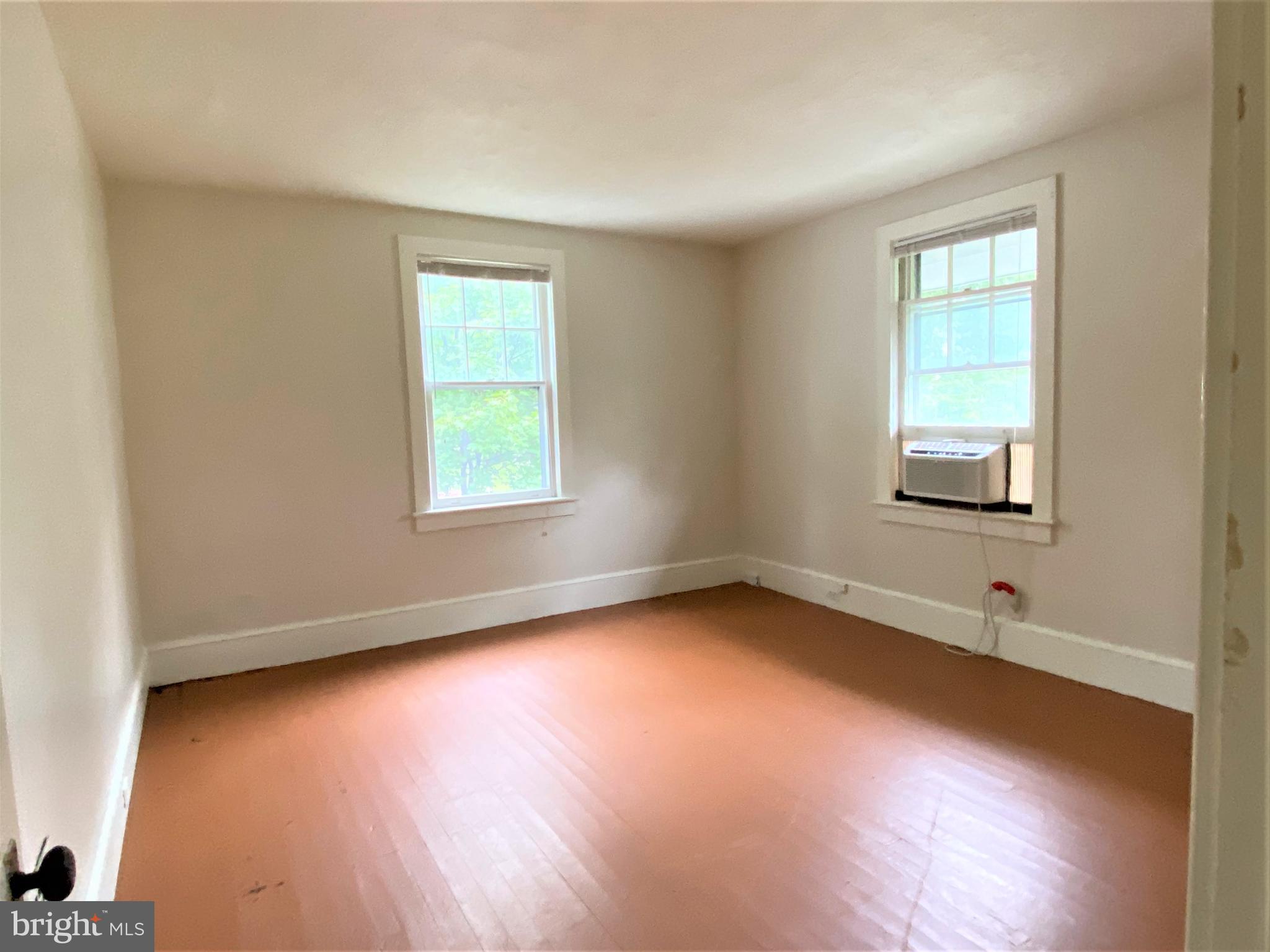 200 Broad Street Mount Holly, NJ 08060 - Photo 12 of 19 an empty room with wooden floor and windows