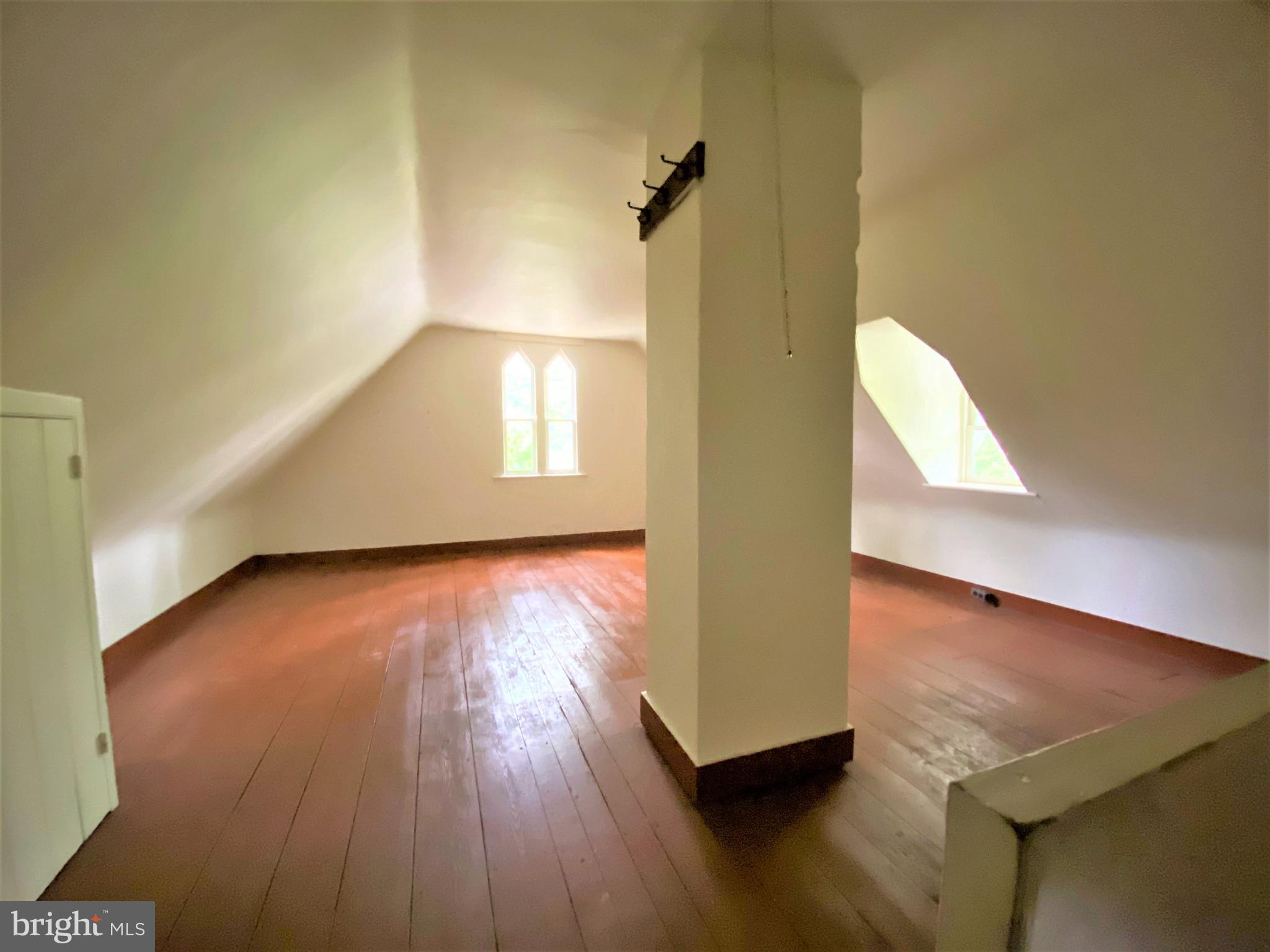 200 Broad Street Mount Holly, NJ 08060 - Photo 17 of 19 wooden floor in an empty room with a window