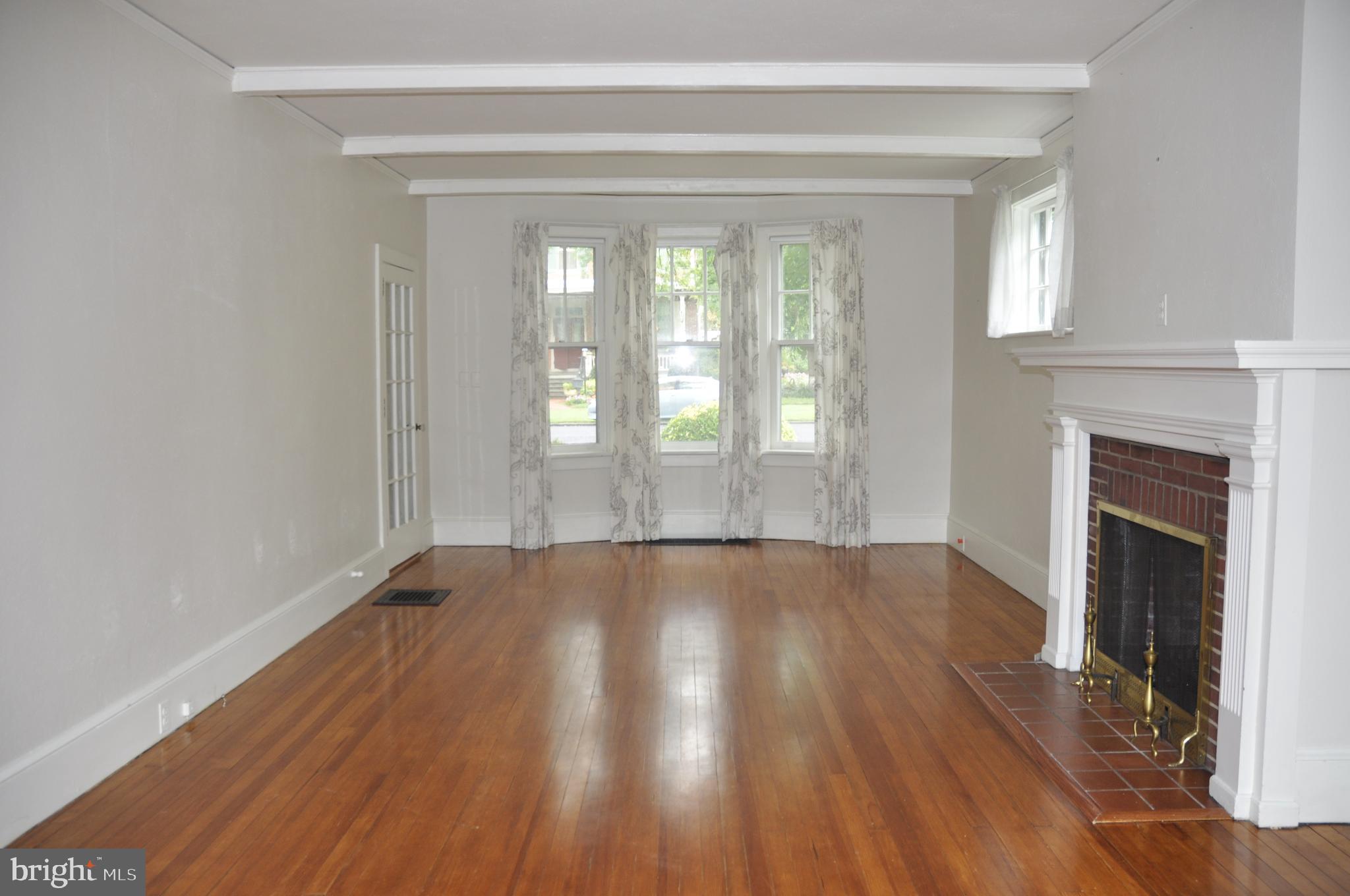 200 Broad Street Mount Holly, NJ 08060 - Photo 3 of 19 a view of an empty room with wooden floor and a window