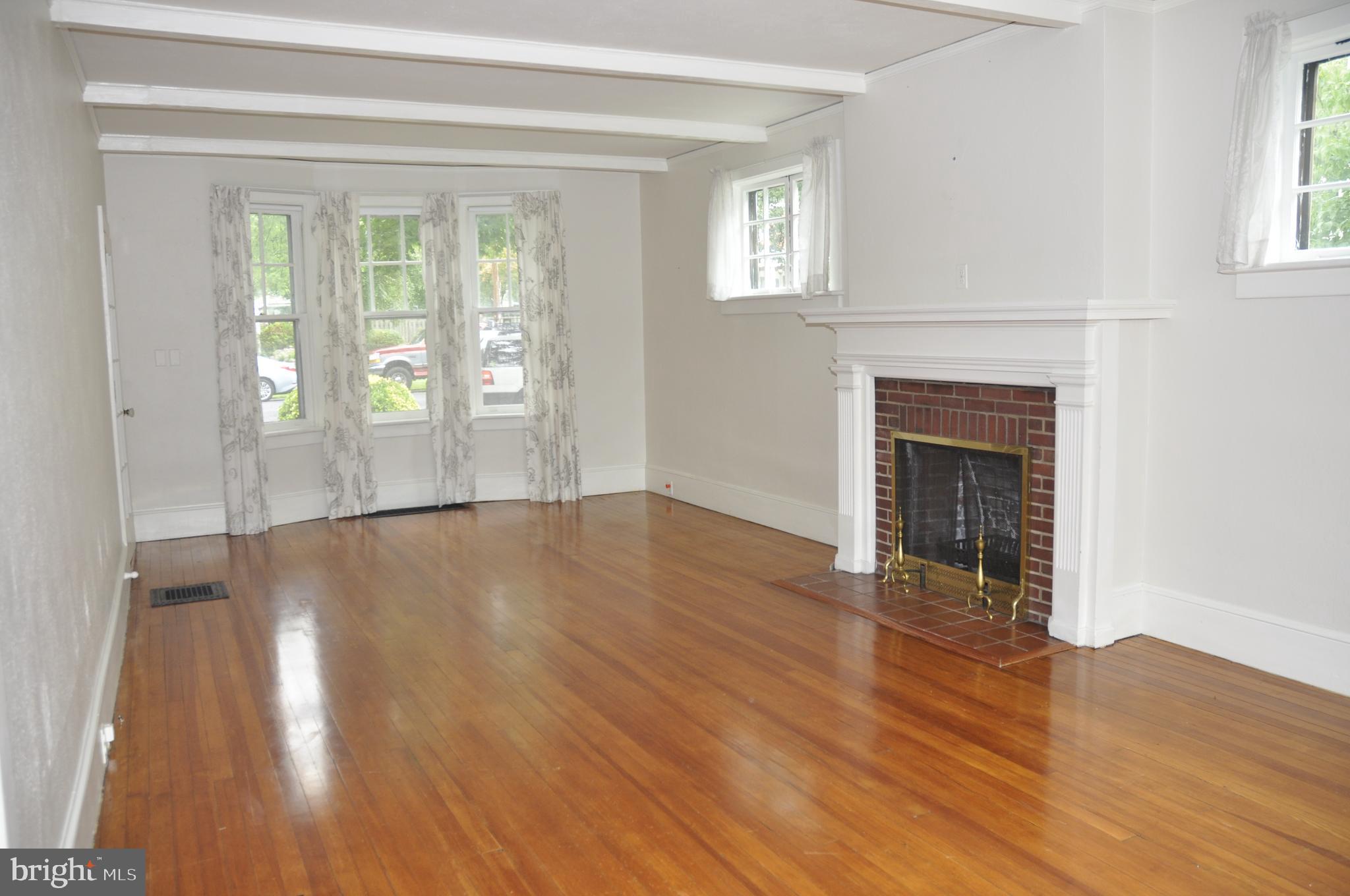 200 Broad Street Mount Holly, NJ 08060 - Photo 4 of 19 a view of an empty room with wooden floor and a window