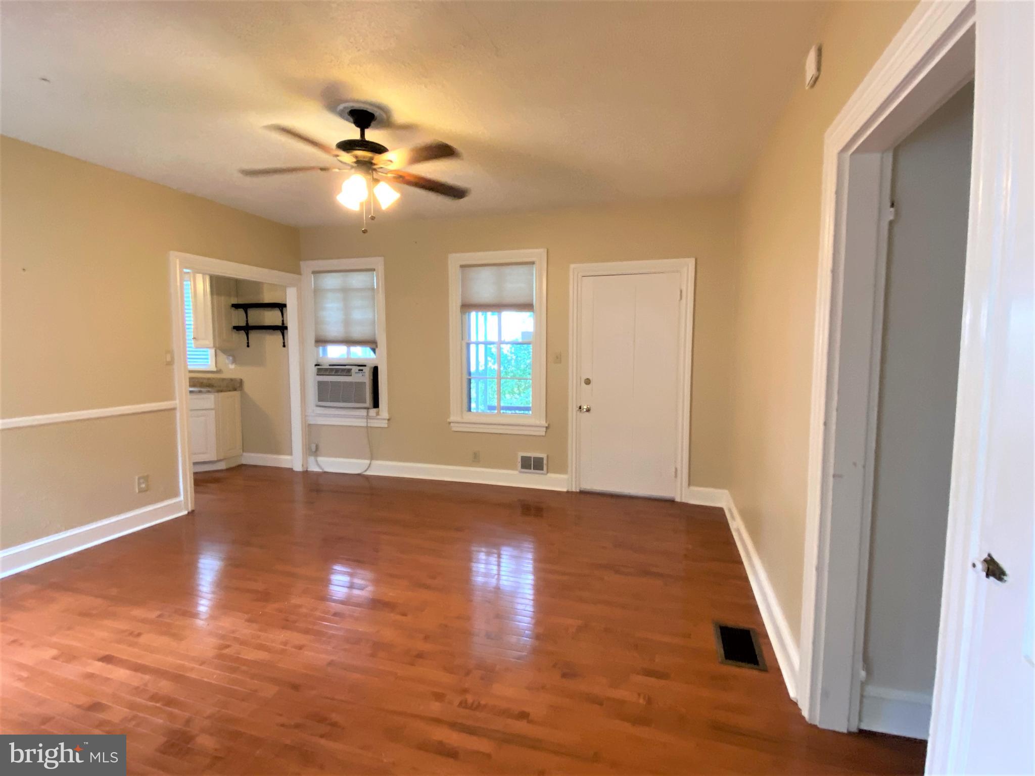 200 Broad Street Mount Holly, NJ 08060 - Photo 5 of 19 a view of an empty room with wooden floor and a window