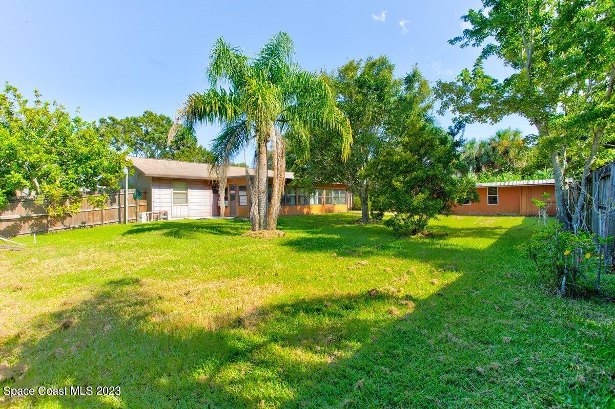 2160 Stewart Road Melbourne, FL 32935 - Photo 12 of 18 a view of a house with a yard porch and sitting area