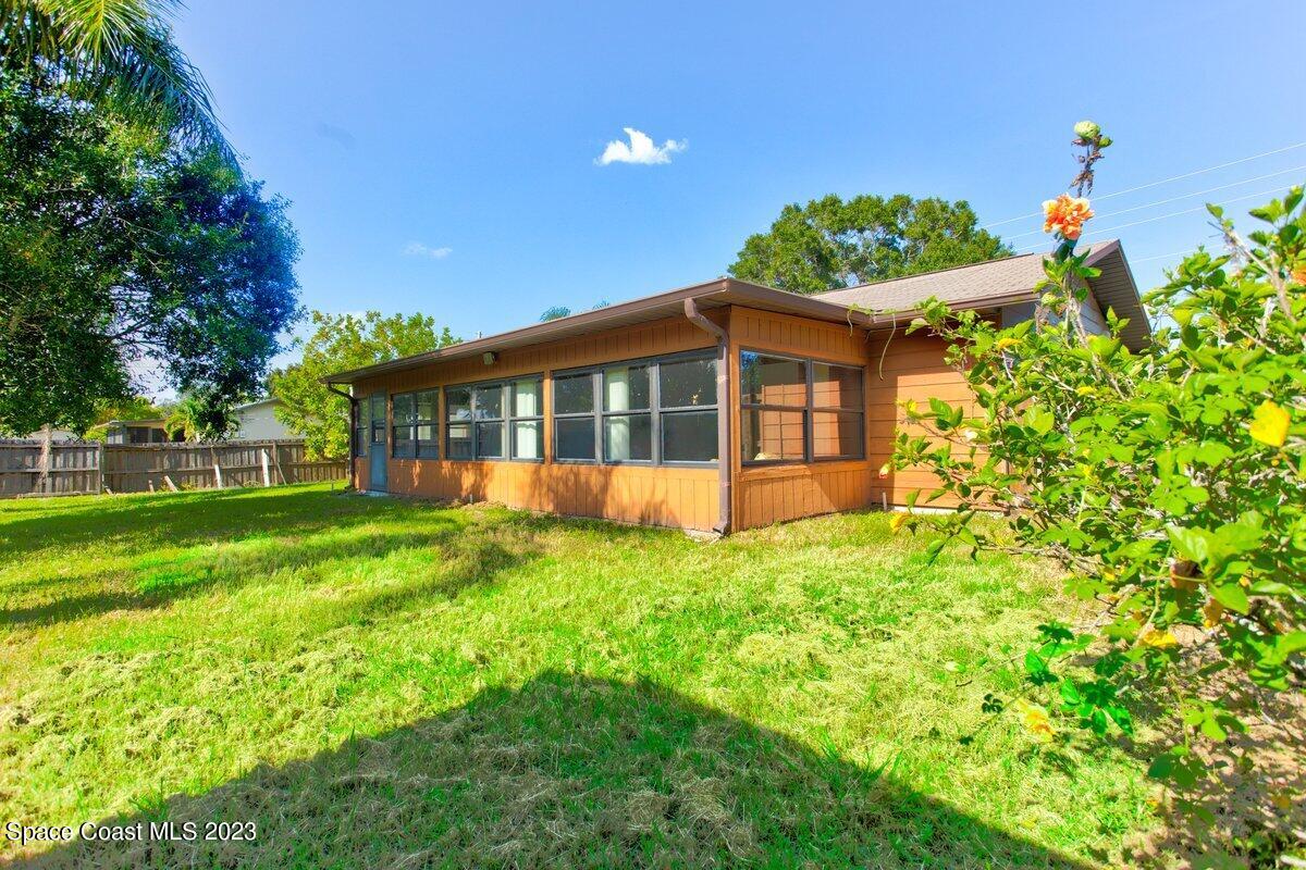 2160 Stewart Road Melbourne, FL 32935 - Photo 13 of 18 a view of a house with a garden