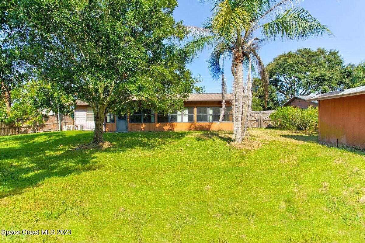 2160 Stewart Road Melbourne, FL 32935 - Photo 16 of 18 a view of a house with a swimming pool
