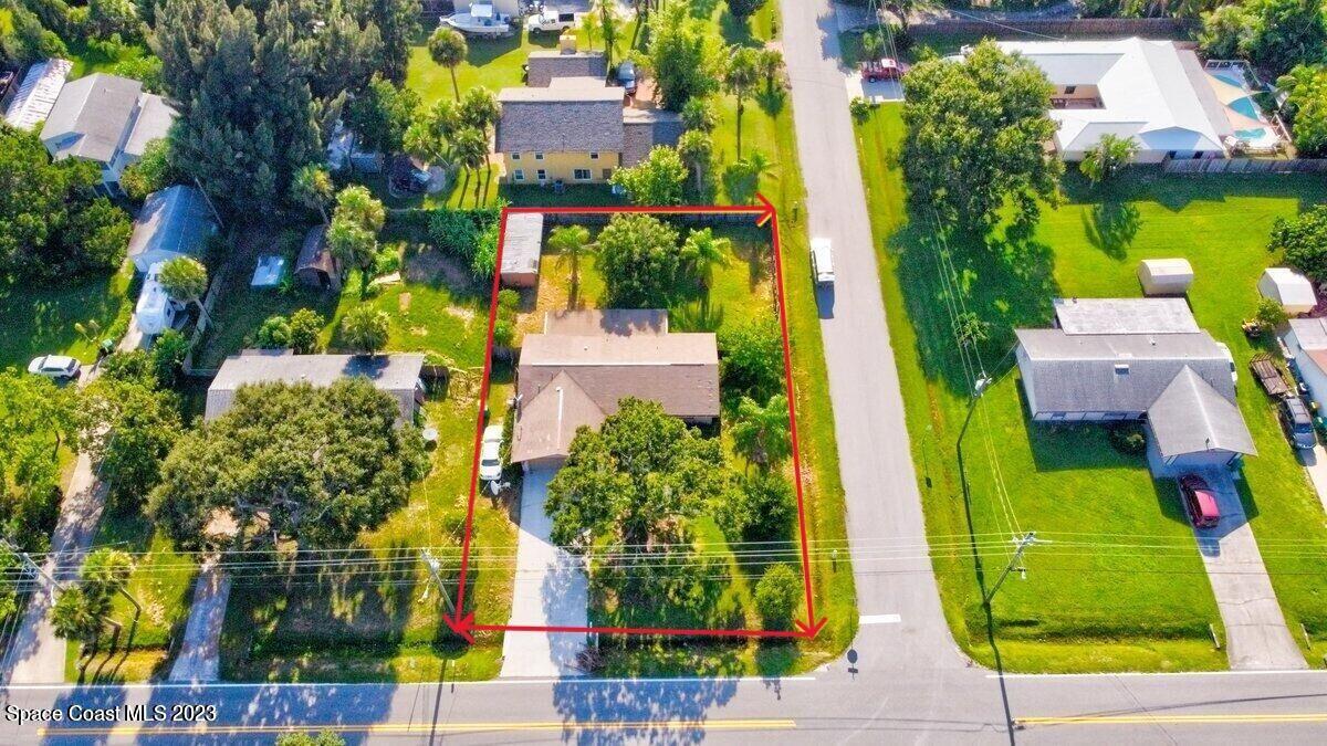 2160 Stewart Road Melbourne, FL 32935 - Photo 18 of 18 an aerial view of multiple houses with yard