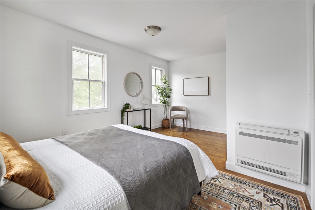 9 Cedar Street, Unit 1 Boston, MA 02119 - Photo 20 of 25 a bedroom with a bed and a window
