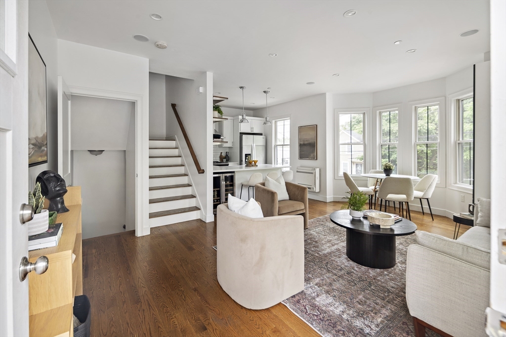 9 Cedar Street, Unit 1 Boston, MA 02119 - Photo 3 of 25 a living room with furniture and large windows