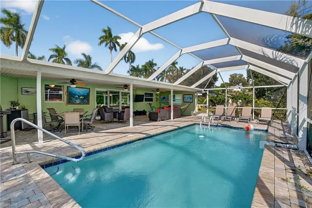 a view of a swimming pool with a patio