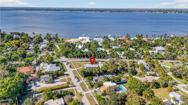 an aerial view of a houses with a yard