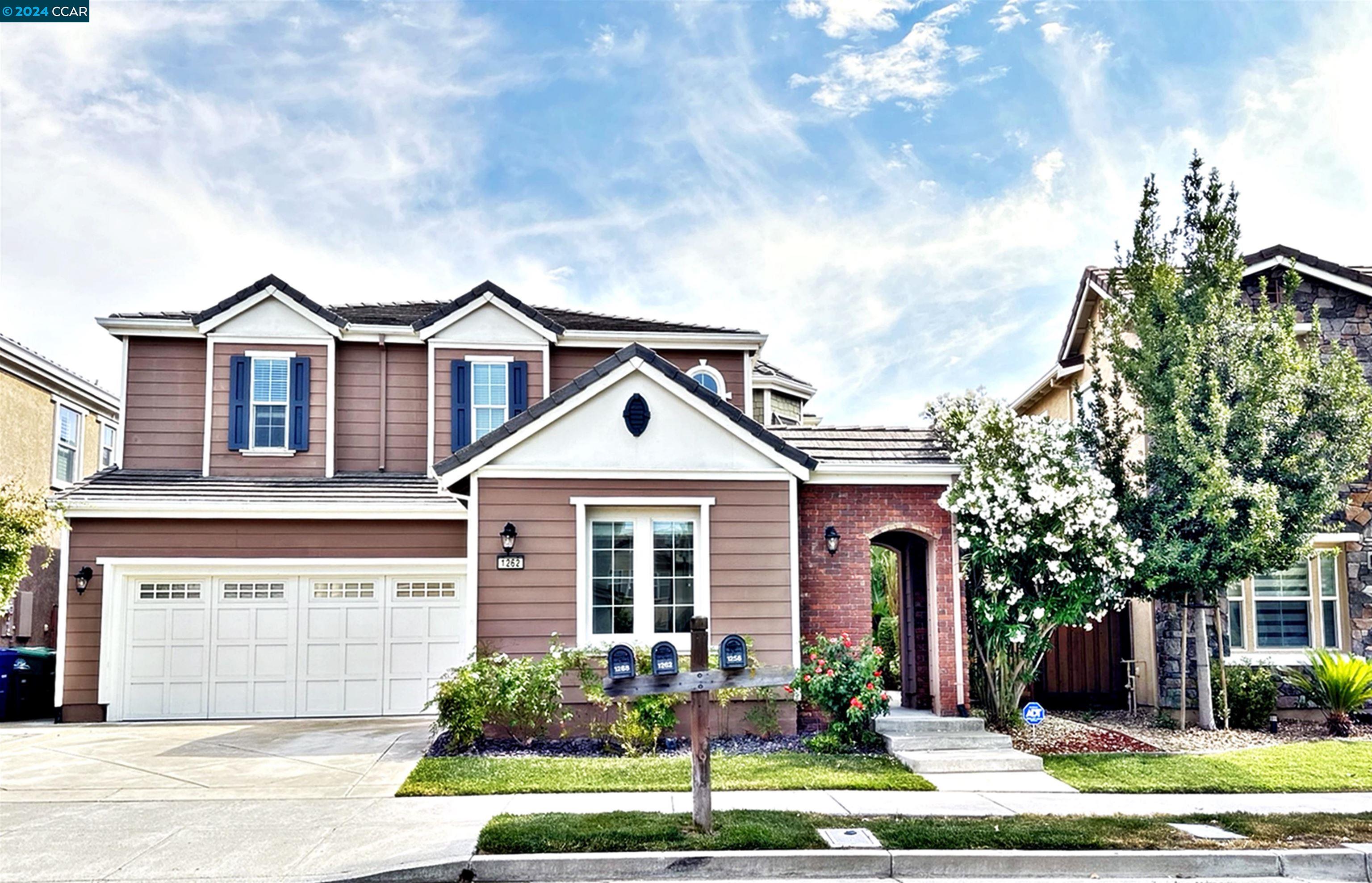 1262 Halifax Way San Ramon, CA 94582 - Photo 1 of 1 a front view of a house with a yard and potted plants