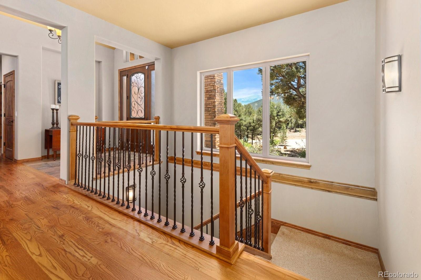 990 Hamilton Creek Road Coaldale, CO 81222 - Photo 6 of 49 a view of staircase with wooden floor and windows